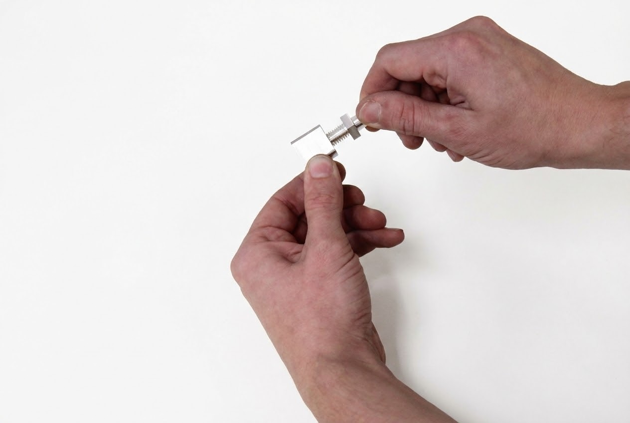 Threading Radsok® pin into pin mount with wrenches