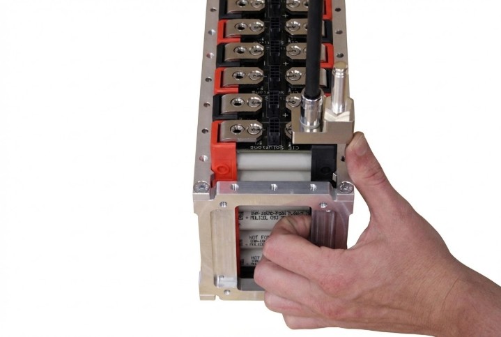 Busbar positioned over module terminals with fasteners being installed